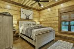 Queen size bedroom with 42` TV and shared bathroom